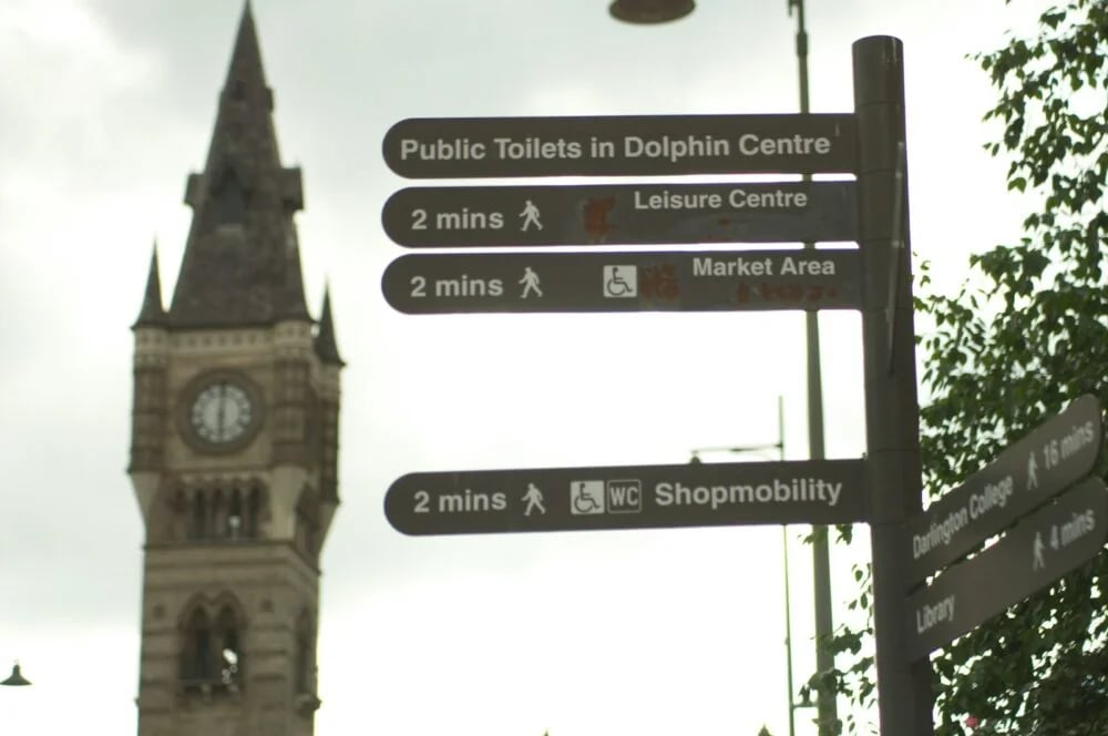 gray post near tower at daytime