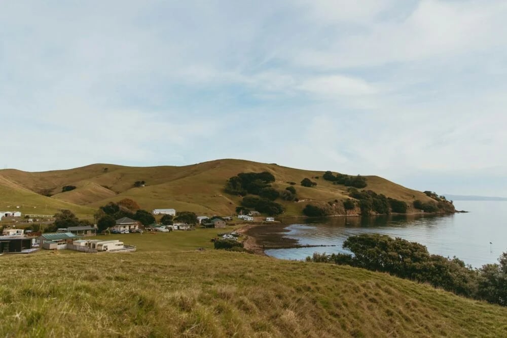 a small town on a hill overlooking a body of water