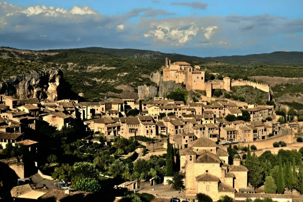 a village in the middle of a mountain range