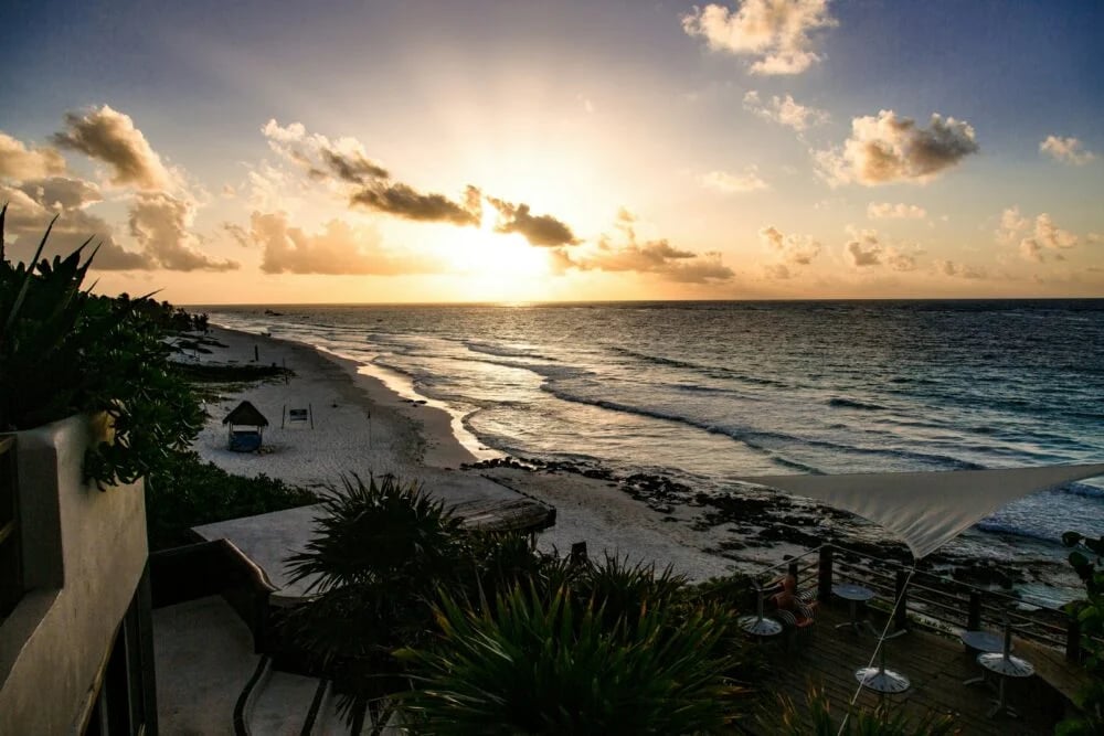 high-angle photography of blue beach under blue sky