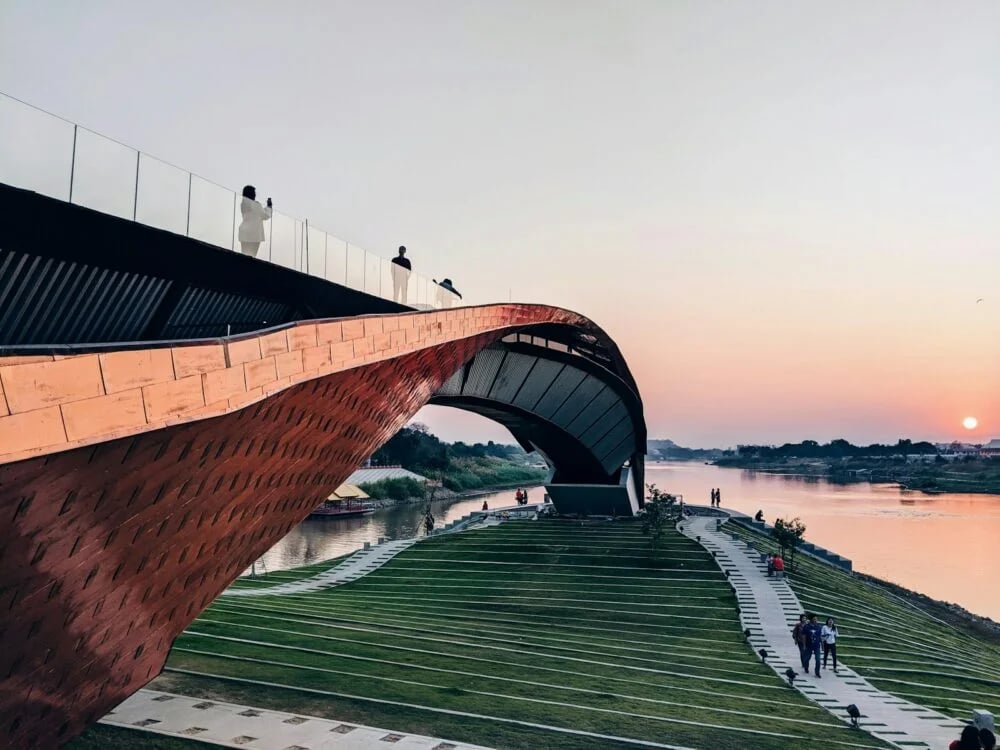 people walking on bridge during daytime