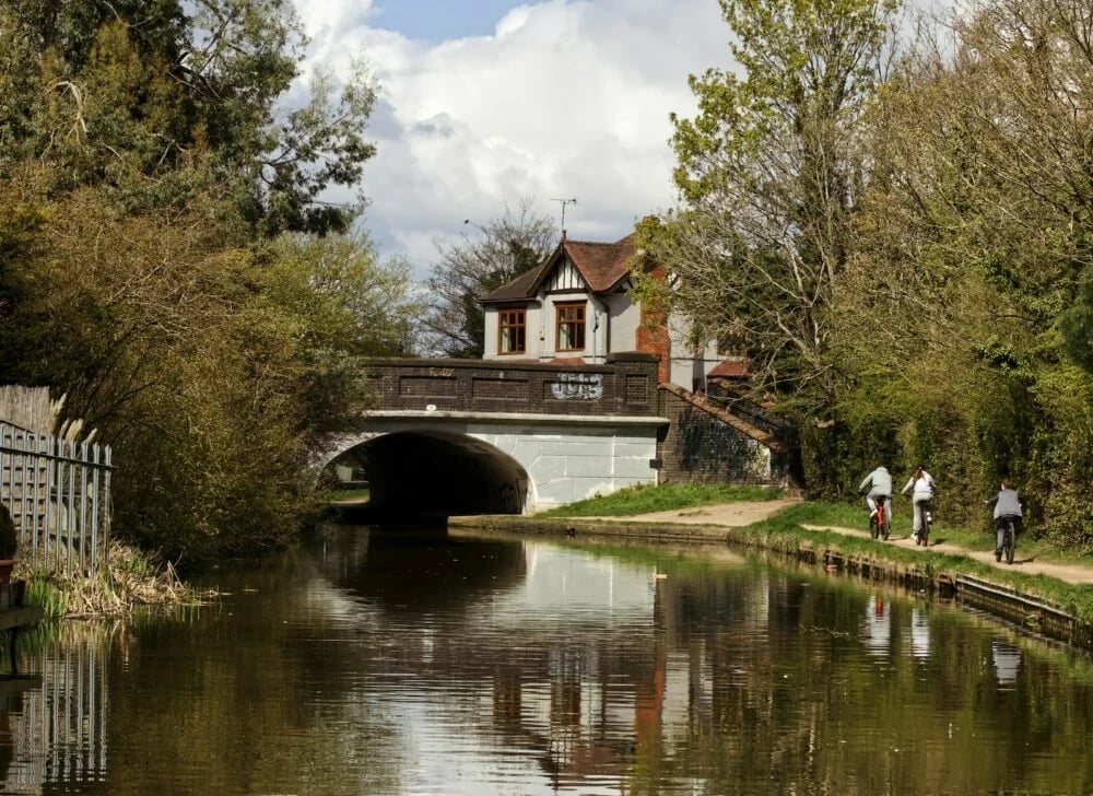 people walking on bridge over river during daytime