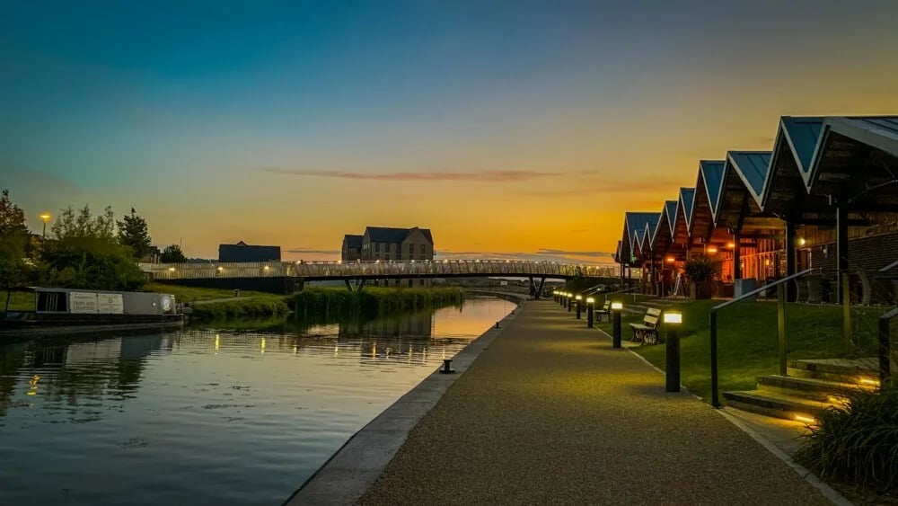 a walkway next to a body of water