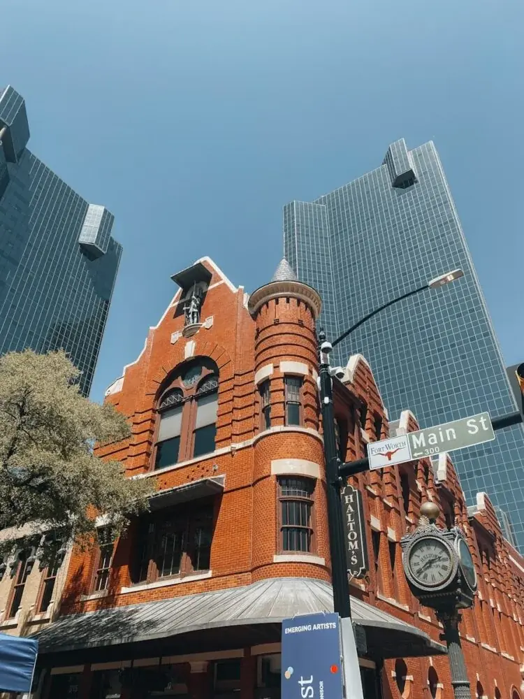 a clock tower next to a large building
