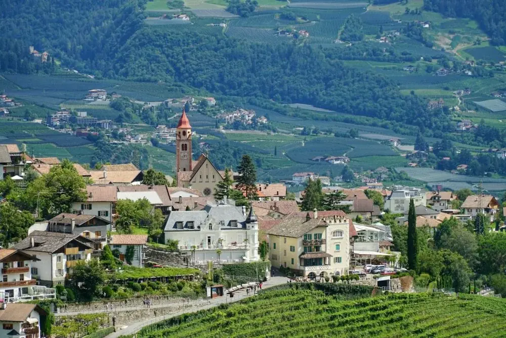 a small village with a church on top of a hill