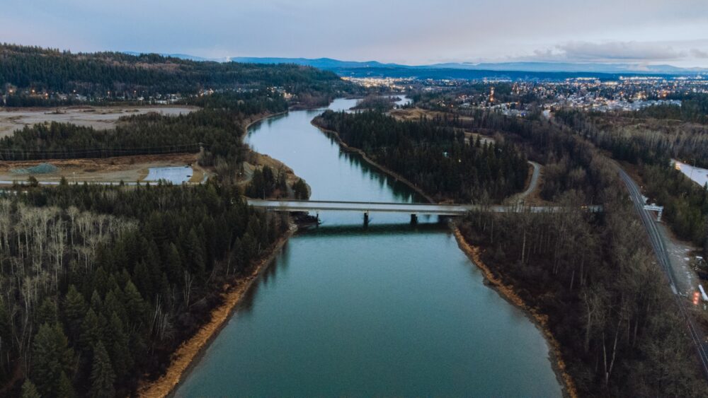 an aerial view of a bridge over a river