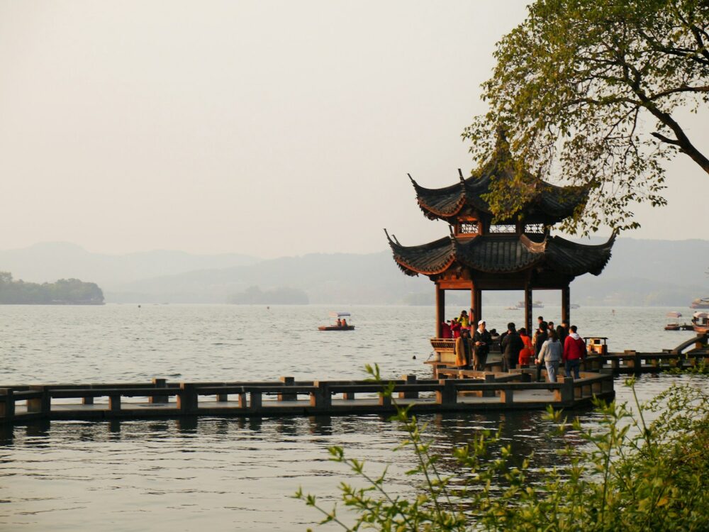 people on brown wooden dock during daytime