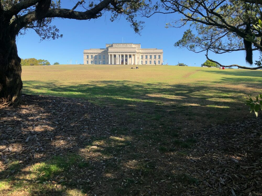 white concrete building near green grass field during daytime